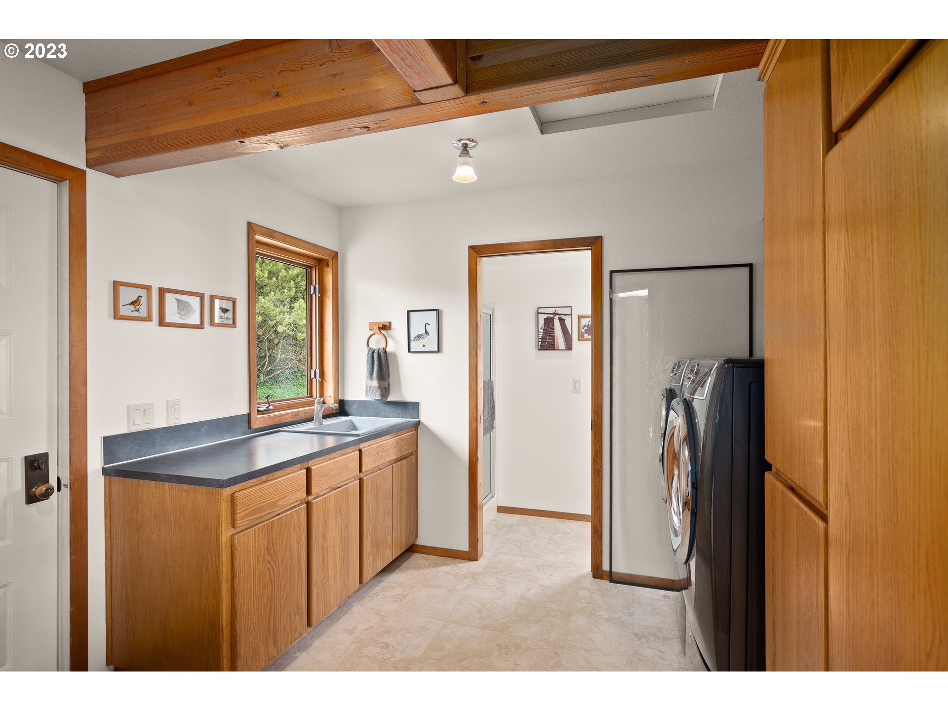 30875 Southwest Laurelview Road Hillsboro, OR 97123 - Photo 19 of 36 a kitchen with stainless steel appliances granite countertop a refrigerator and a sink