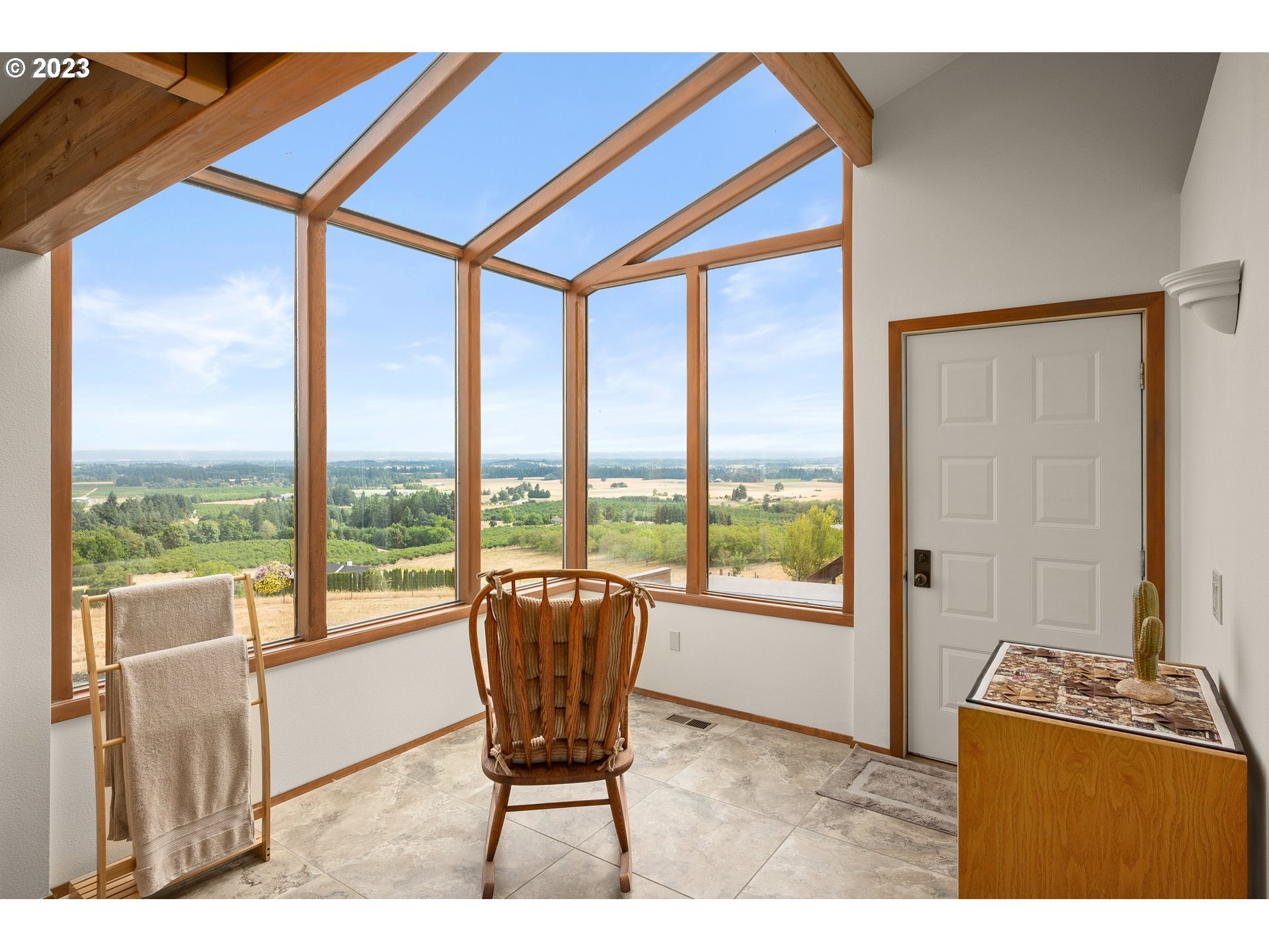 30875 Southwest Laurelview Road Hillsboro, OR 97123 - Photo 21 of 36 a living room with furniture and a floor to ceiling window