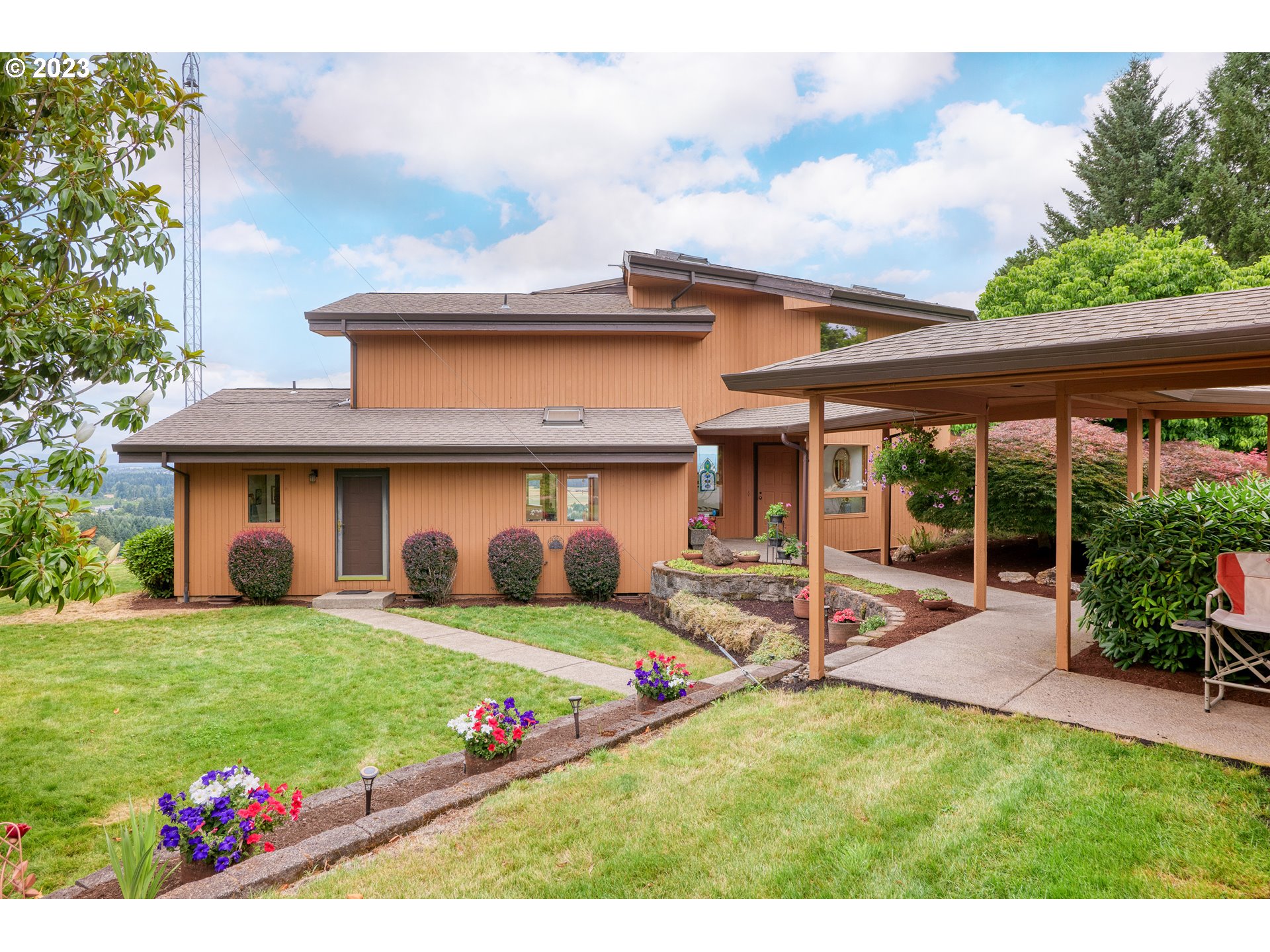 30875 Southwest Laurelview Road Hillsboro, OR 97123 - Photo 5 of 36 a view of a house with a yard and sitting area