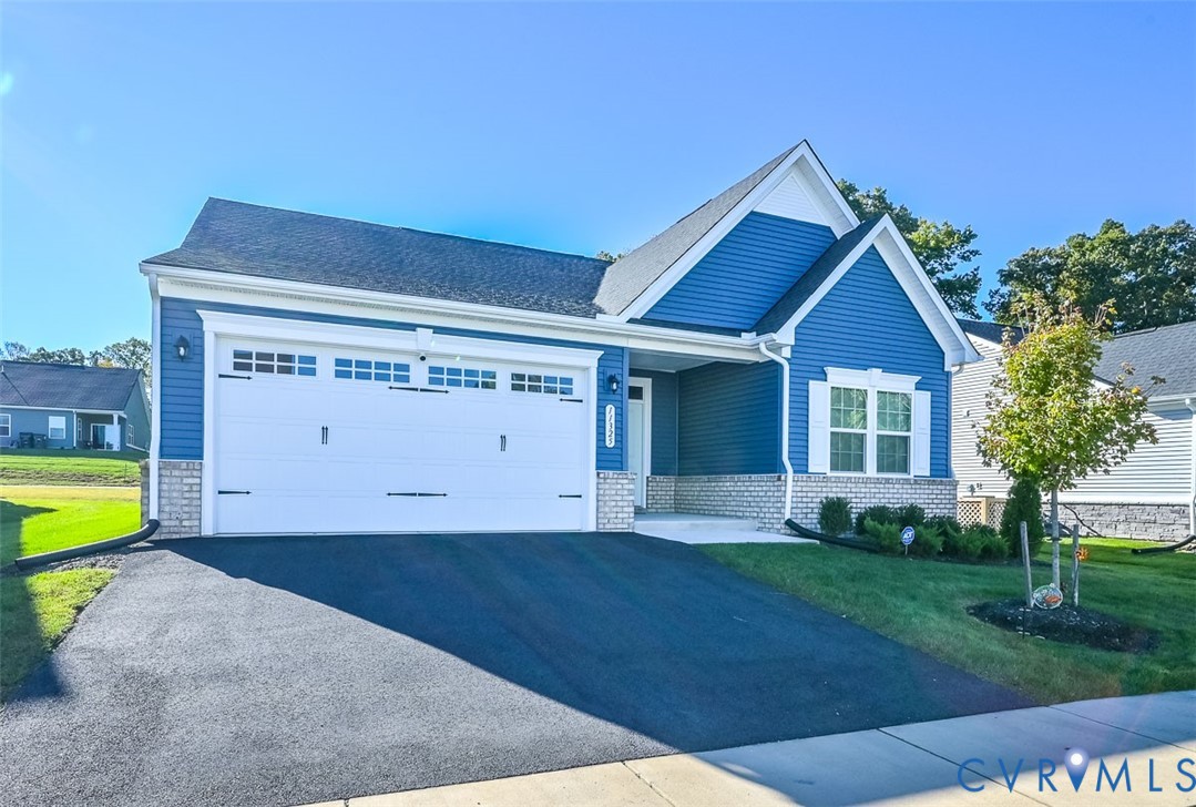 11325 Vulcan Lane Chester, VA 23831 - Photo 2 of 37 a front view of a house with a yard and a garage