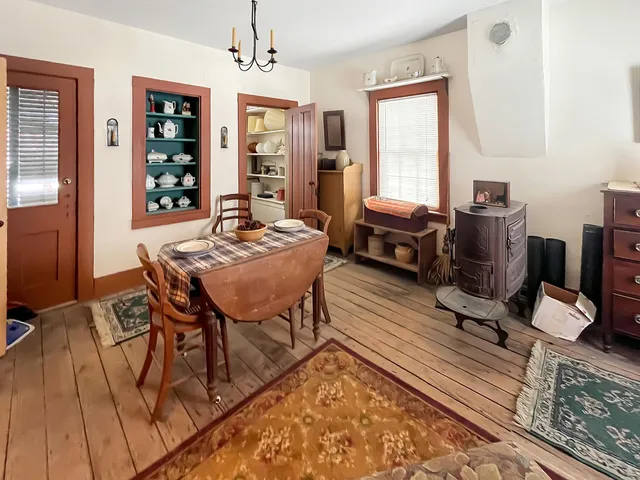 a living room with furniture a window and a chandelier