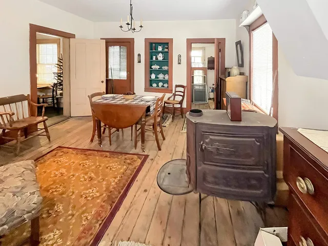 a view of a livingroom with furniture window and wooden floor