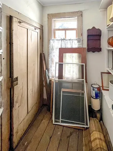 a kitchen with a refrigerator and a window