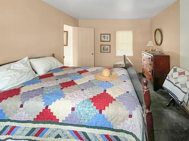 a bedroom with a bed and a closet