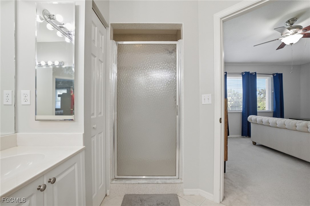 13160 Broadhurst Loop, Unit 101 Fort Myers, FL 33919 - Photo 24 of 39 a bathroom with a tub shower and sink