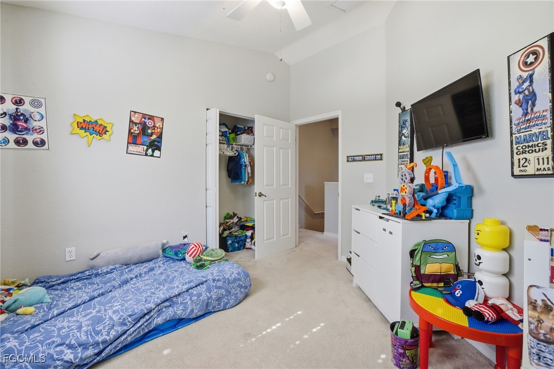13160 Broadhurst Loop, Unit 101 Fort Myers, FL 33919 - Photo 26 of 39 a room with toys and flat screen tv