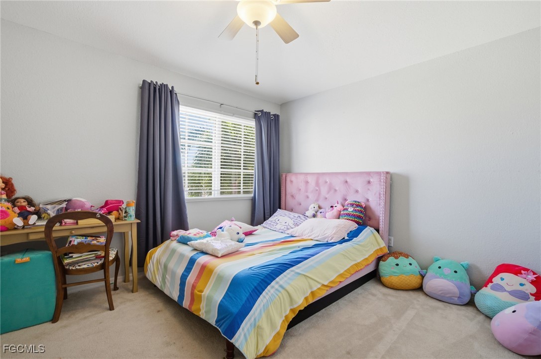 13160 Broadhurst Loop, Unit 101 Fort Myers, FL 33919 - Photo 28 of 39 a bedroom with a bed and a window