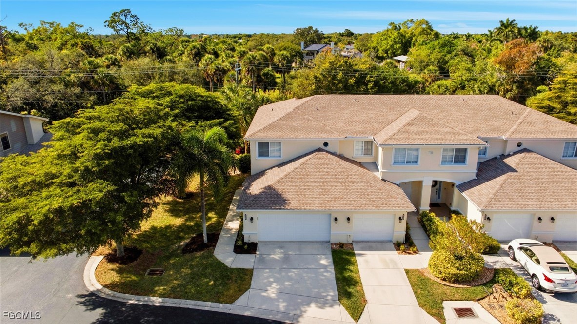 13160 Broadhurst Loop, Unit 101 Fort Myers, FL 33919 - Photo 34 of 39 a view of house with a yard