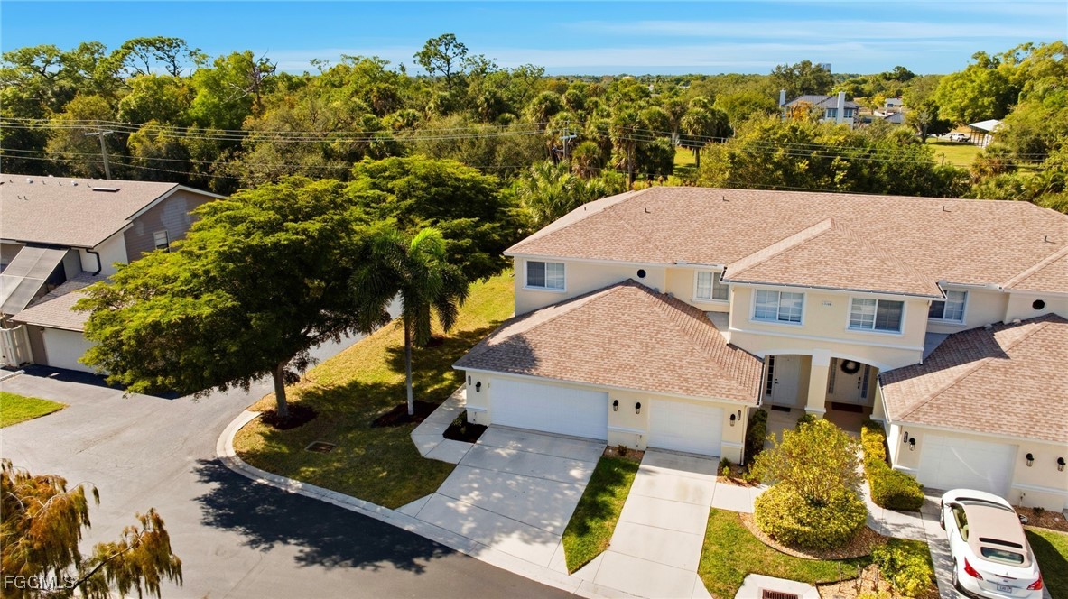 13160 Broadhurst Loop, Unit 101 Fort Myers, FL 33919 - Photo 35 of 39 an aerial view of a house with a yard