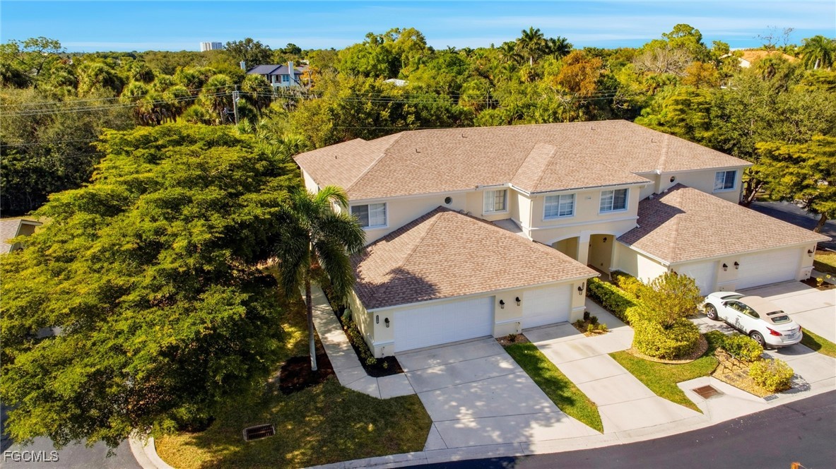 13160 Broadhurst Loop, Unit 101 Fort Myers, FL 33919 - Photo 36 of 39 an aerial view of a house with a yard