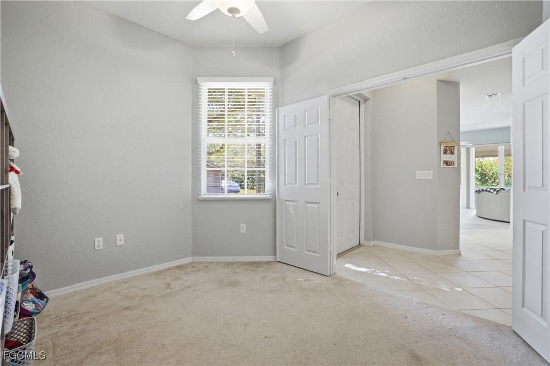 13160 Broadhurst Loop, Unit 101 Fort Myers, FL 33919 - Photo 4 of 39 an empty room with windows and closet