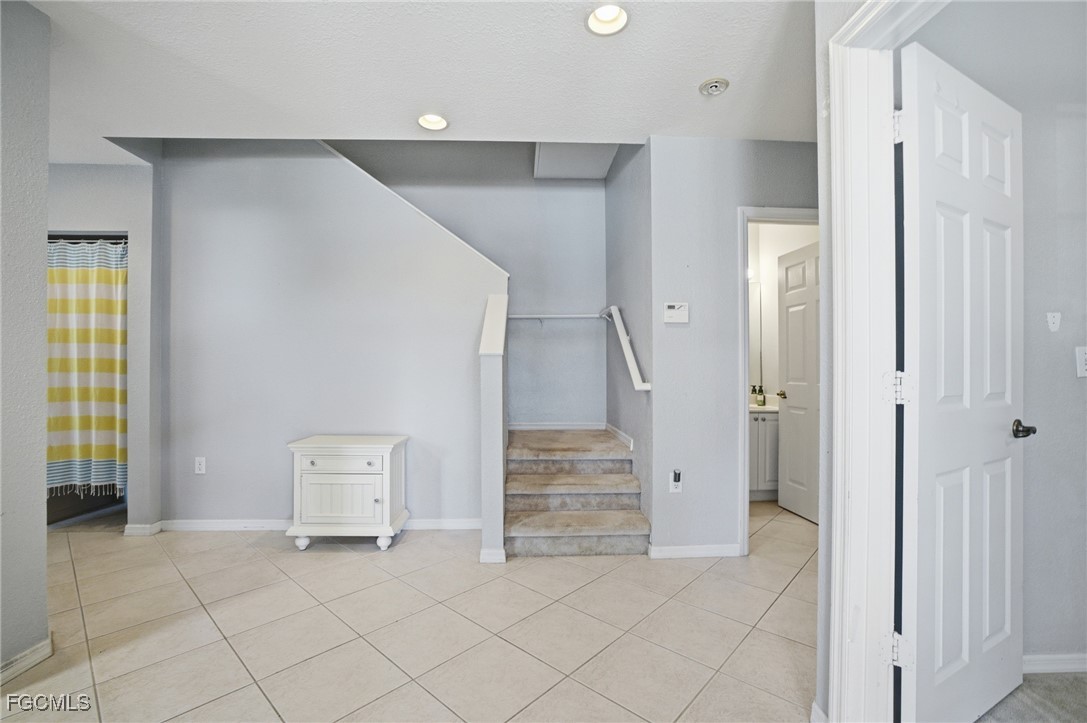 13160 Broadhurst Loop, Unit 101 Fort Myers, FL 33919 - Photo 5 of 39 a view of an entryway with stairs