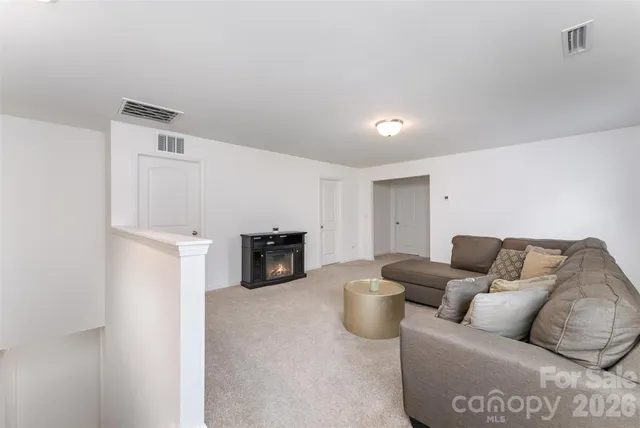 a living room with furniture and a couch