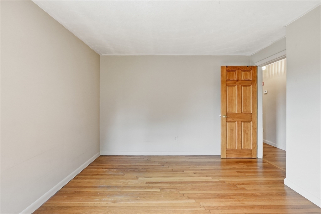 28 Spring Road Westborough, MA 01581 - Photo 21 of 42 a view of empty room with wooden floor and fan