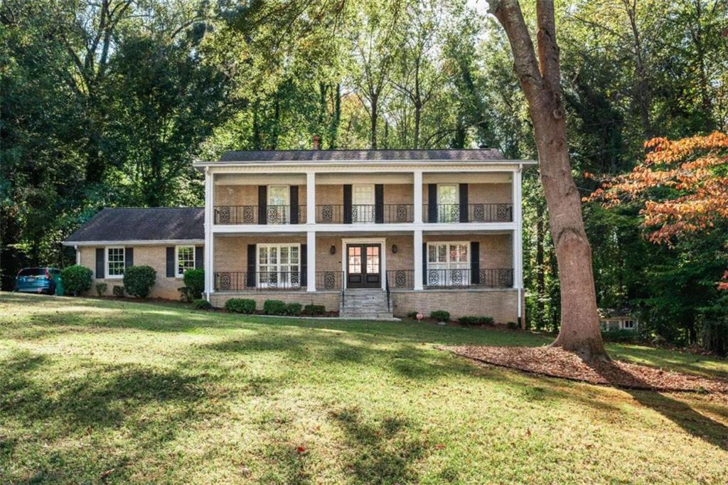 7500 Spalding Lane Sandy Springs, GA 30350 - Photo 1 of 1 a view of a yard in front of a house