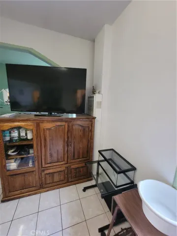 a room with furniture and flat screen tv