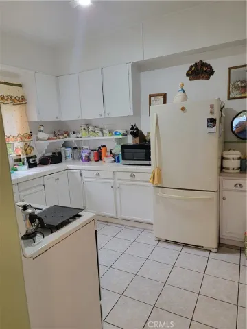 a kitchen with a sink a cabinetry and appliances