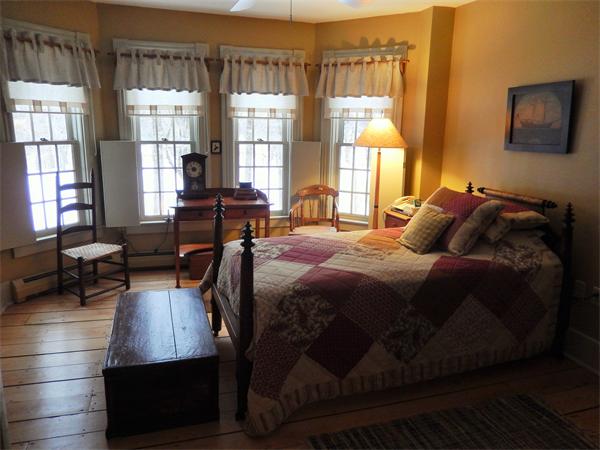 317 Worcester Road Princeton, MA 01541 - Photo 18 of 23 a bedroom with a bed window and a desk