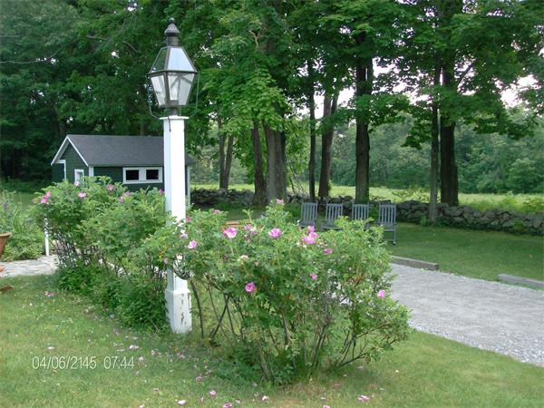 317 Worcester Road Princeton, MA 01541 - Photo 8 of 23 a front view of a house with garden