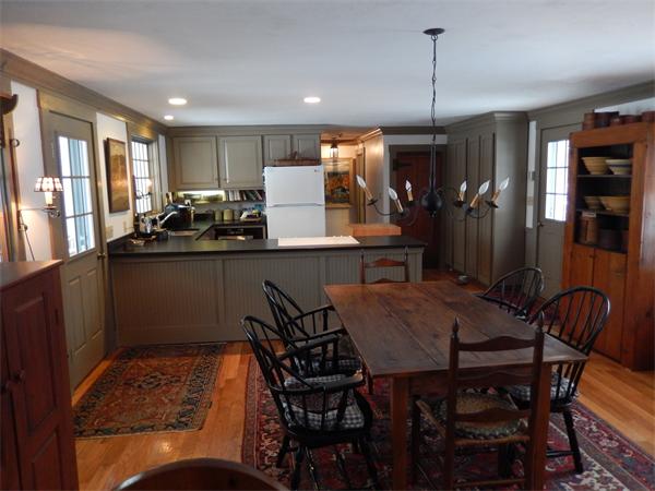 317 Worcester Road Princeton, MA 01541 - Photo 9 of 23 a kitchen with stainless steel appliances granite countertop a sink a stove a dining table and chairs
