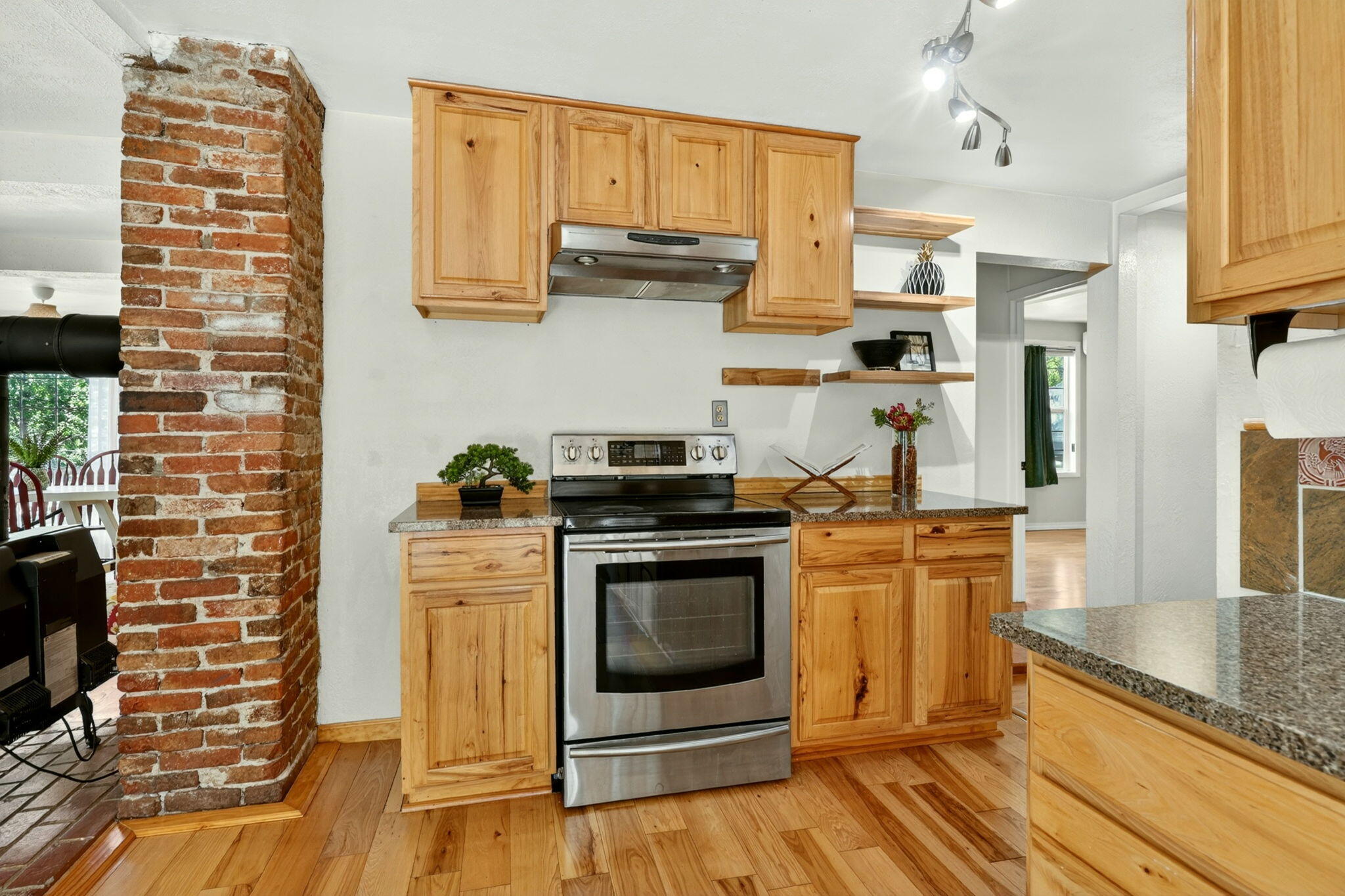 51 Sterling Creek Road Jacksonville, OR 97530 - Photo 14 of 54 a kitchen with stainless steel appliances granite countertop a stove a sink and a microwave