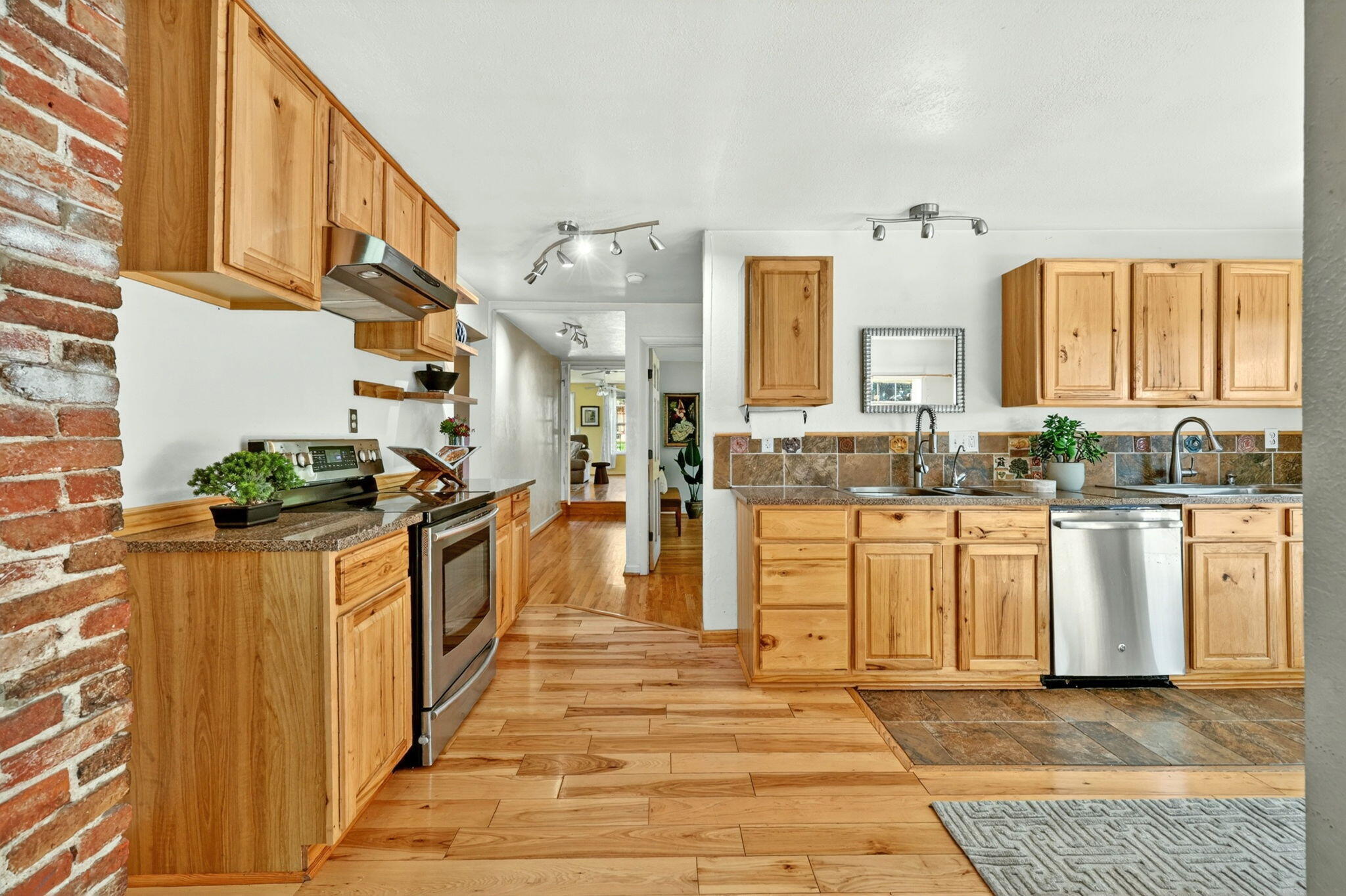 51 Sterling Creek Road Jacksonville, OR 97530 - Photo 16 of 54 a kitchen with white cabinets and white appliances