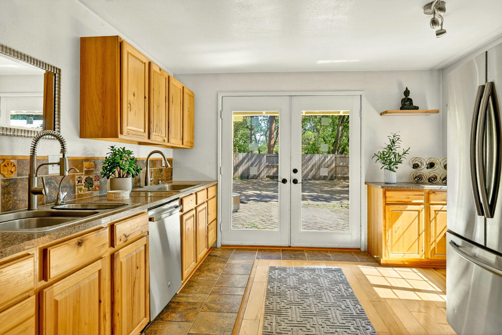 51 Sterling Creek Road Jacksonville, OR 97530 - Photo 19 of 54 a kitchen with stainless steel appliances a refrigerator sink and cabinets