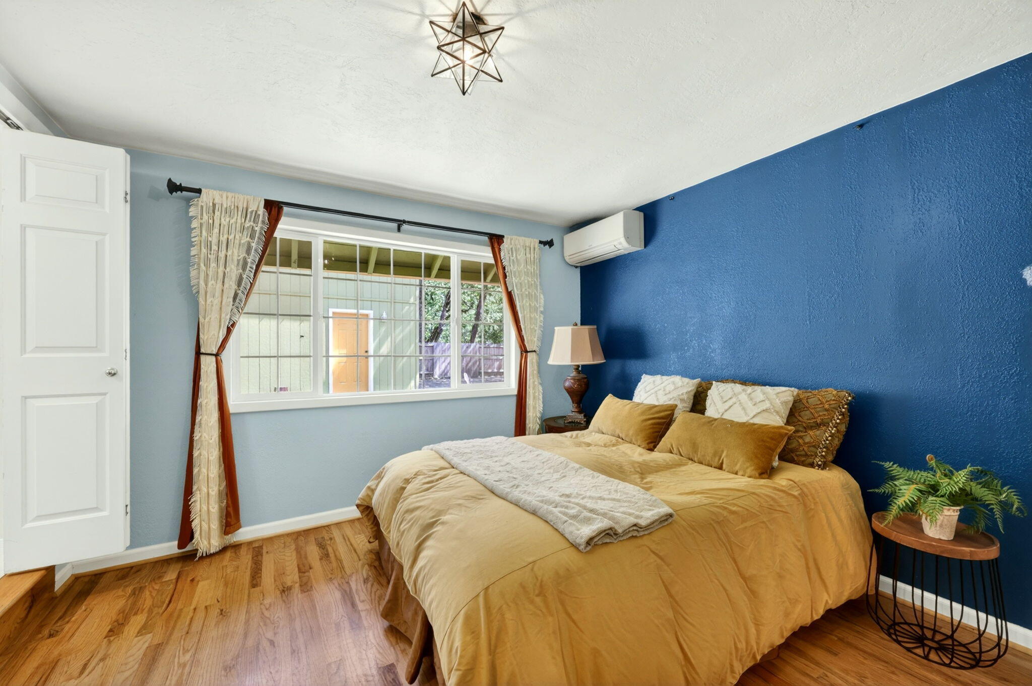 51 Sterling Creek Road Jacksonville, OR 97530 - Photo 23 of 54 a bedroom with a bed and wooden floor