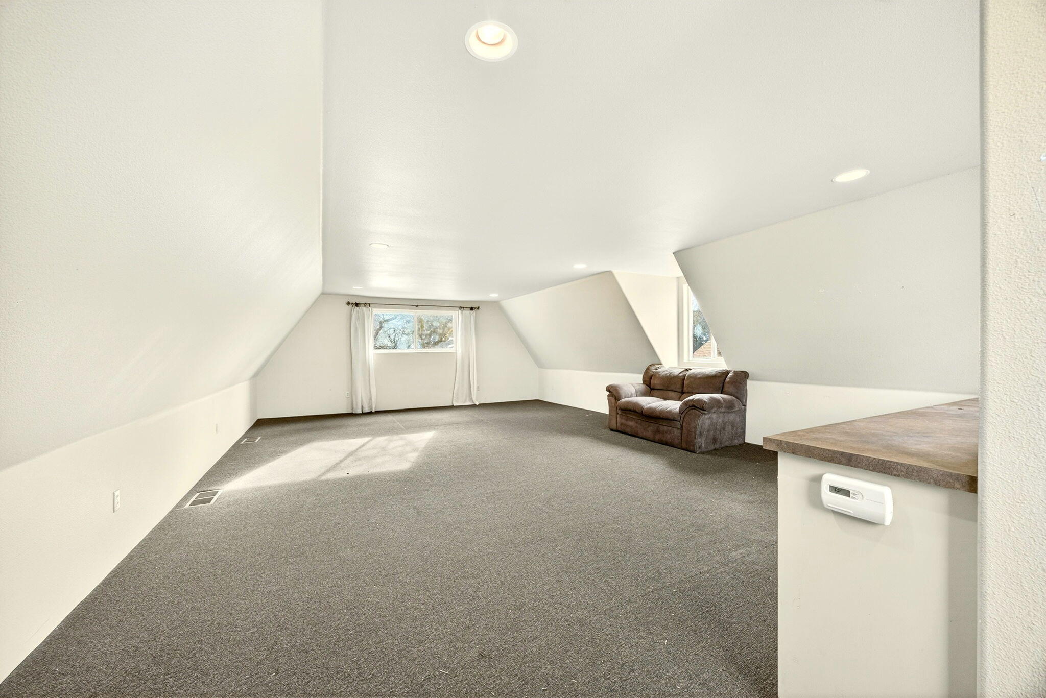 51 Sterling Creek Road Jacksonville, OR 97530 - Photo 44 of 54 a view of a livingroom with a couch and a ceiling fan