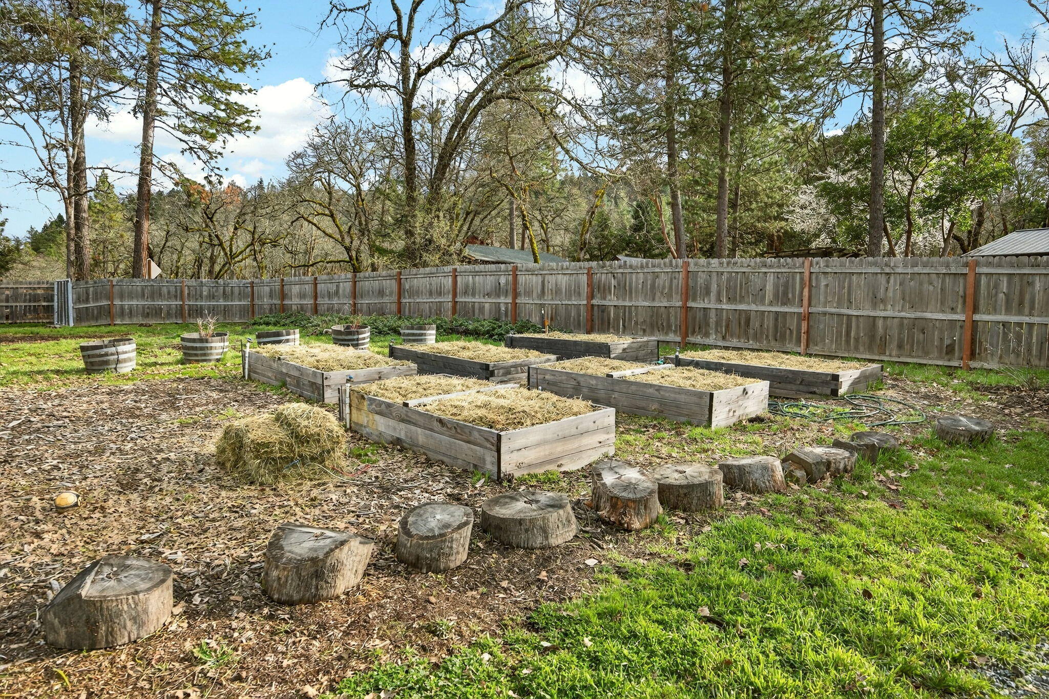 51 Sterling Creek Road Jacksonville, OR 97530 - Photo 49 of 54 a backyard of a house with lots of green space and fountain