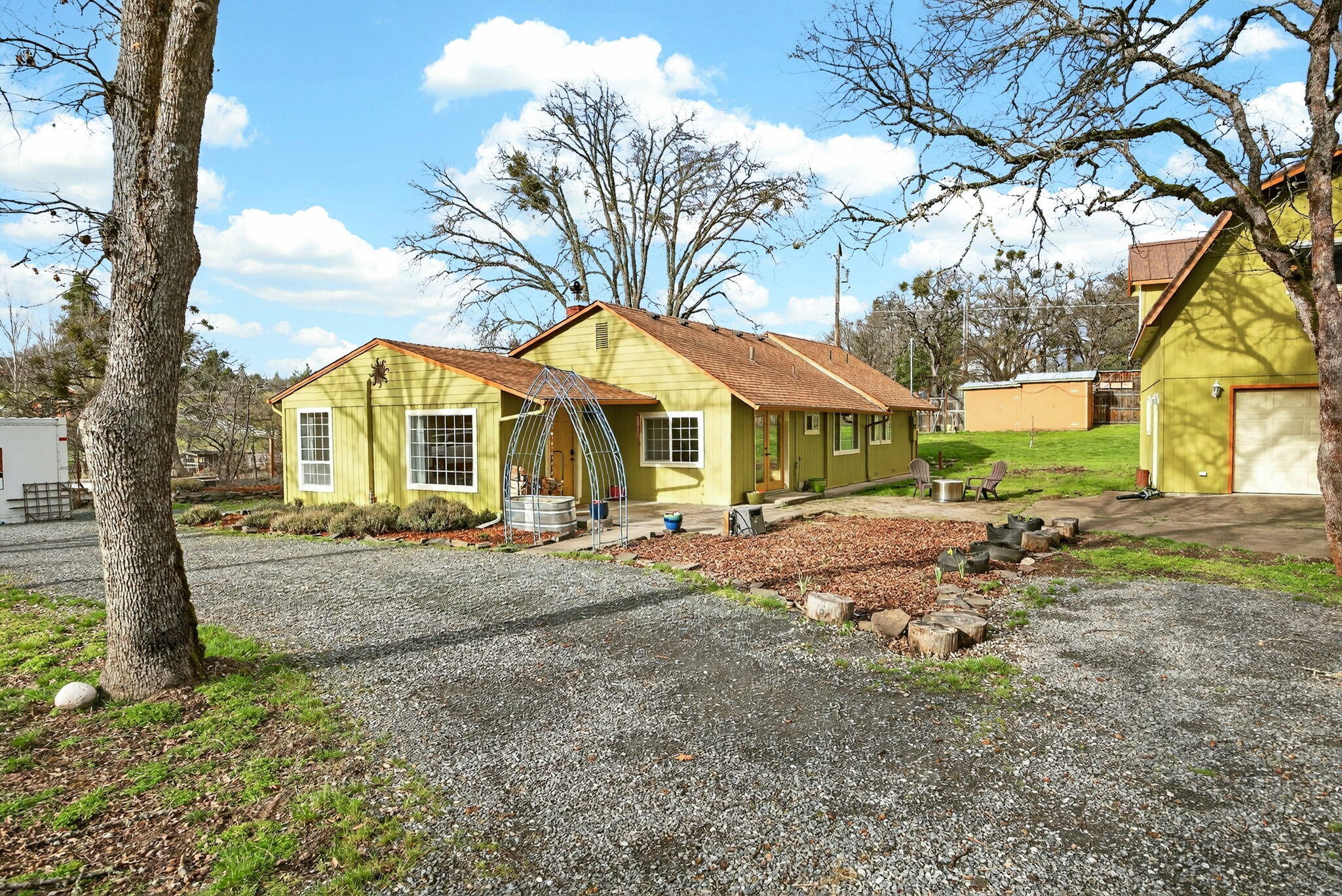 51 Sterling Creek Road Jacksonville, OR 97530 - Photo 4 of 54 a view of a house with a yard and pathway