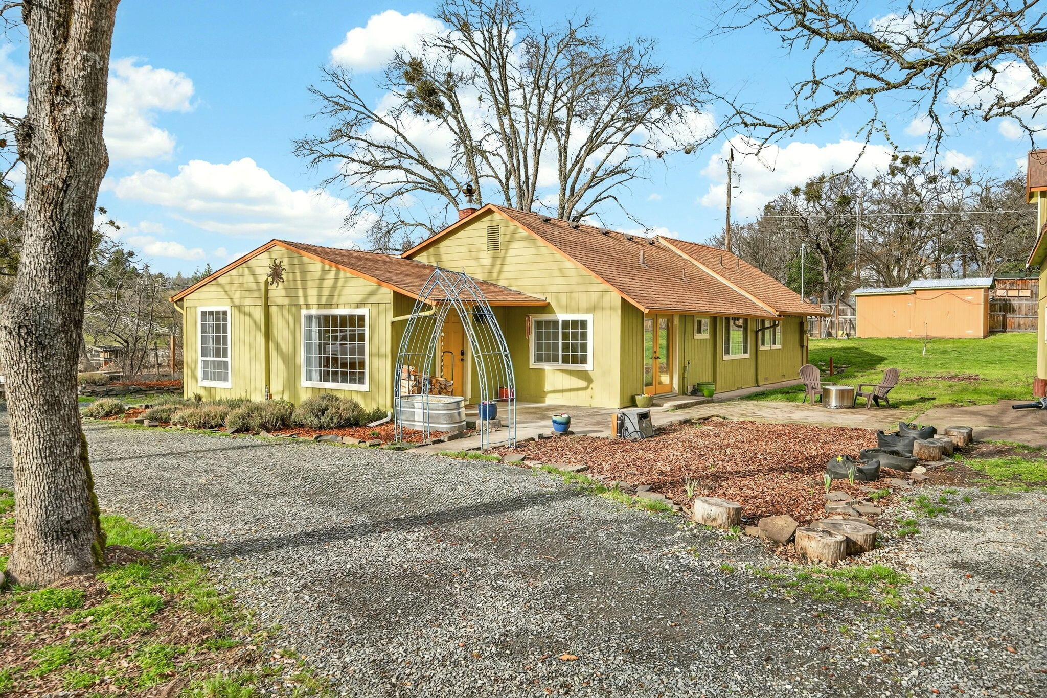 51 Sterling Creek Road Jacksonville, OR 97530 - Photo 6 of 54 a view of a house with a yard and sitting area