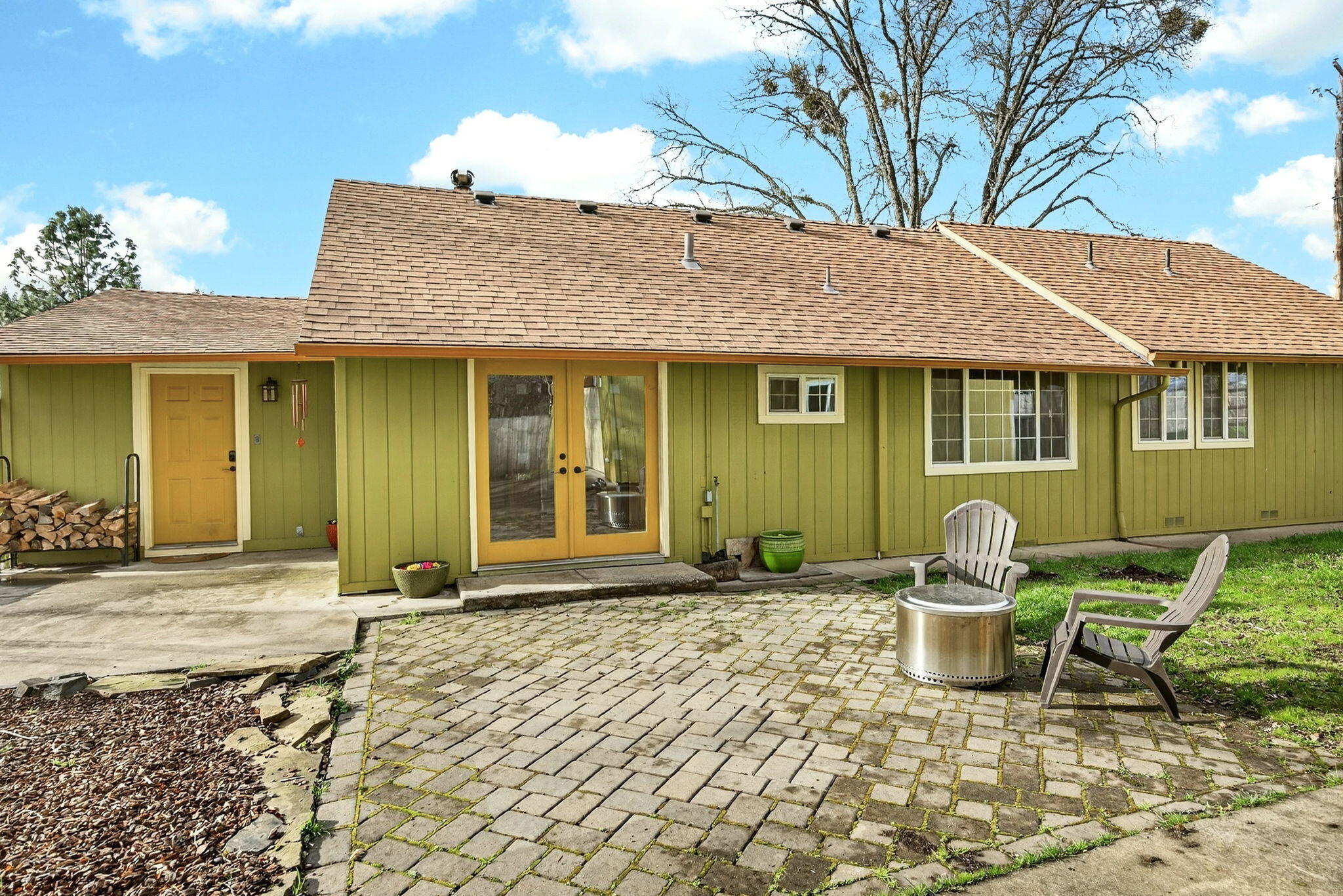 51 Sterling Creek Road Jacksonville, OR 97530 - Photo 8 of 54 a front view of a house with outdoor seating