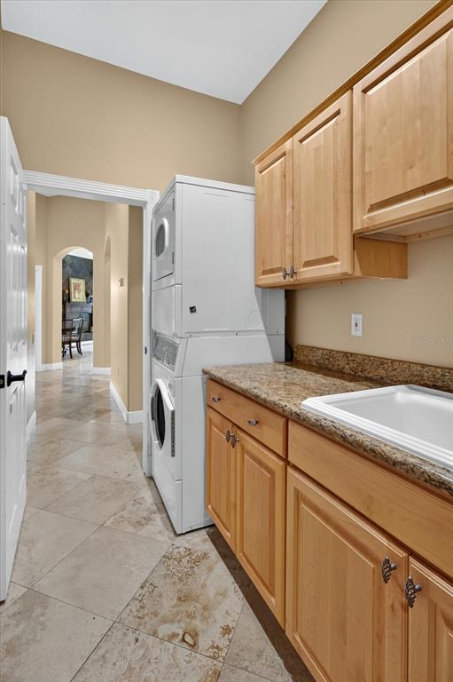 9427 Eddings Road Odessa, FL 33556 - Photo 65 of 93 a spacious bathroom with stainless steel appliances granite countertop a sink and cabinets