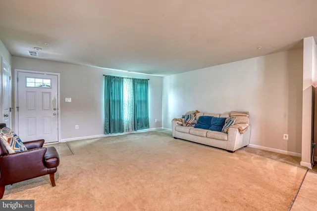 a spacious bedroom with a bed and a couch