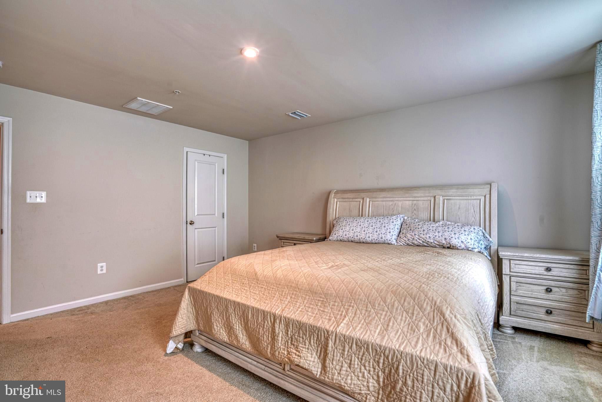 11 Saddle Bill Circle Cambridge, MD 21613 - Photo 21 of 31 a bedroom with a bed and a tv