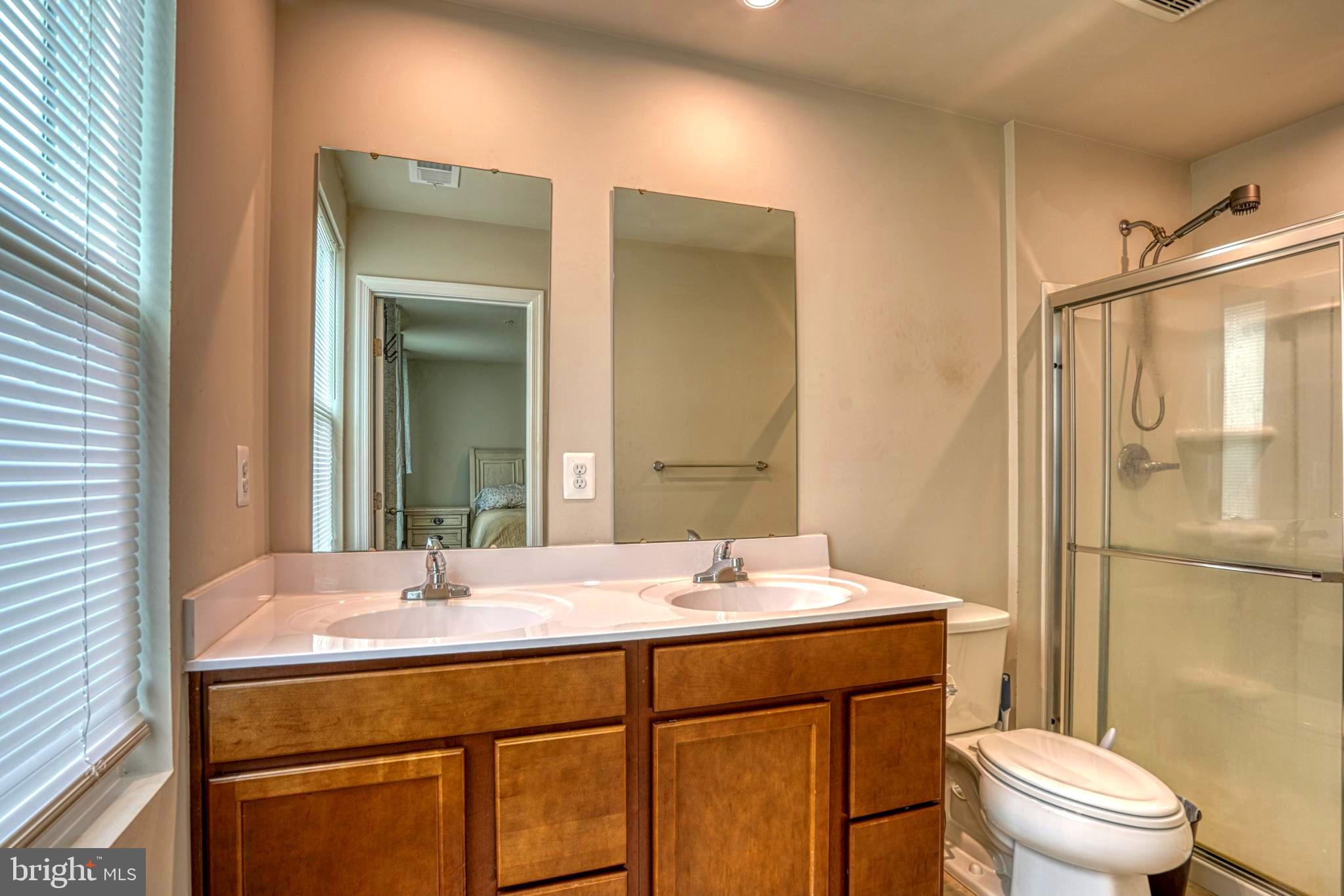 11 Saddle Bill Circle Cambridge, MD 21613 - Photo 22 of 31 a bathroom with a sink toilet and shower