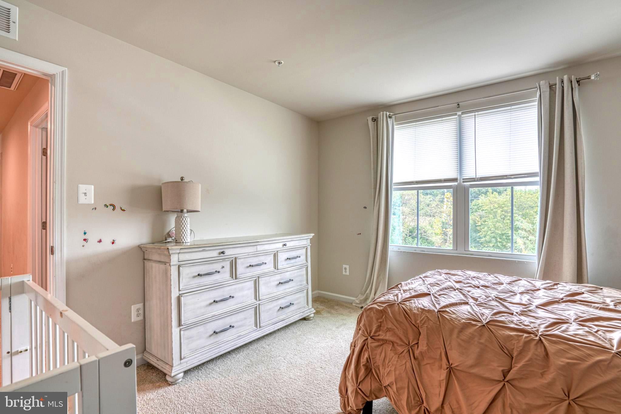 11 Saddle Bill Circle Cambridge, MD 21613 - Photo 27 of 31 a bedroom with a bed and a window