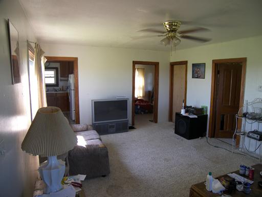 3263 East 8th Road Utica, IL 61373 - Photo 3 of 9 a living room with furniture and a chandelier