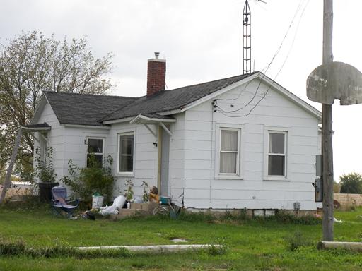 3263 East 8th Road Utica, IL 61373 - Photo 7 of 9 a front view of a house with a garden and plants