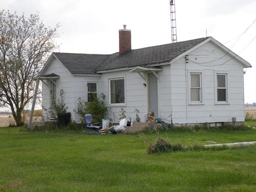 3263 East 8th Road Utica, IL 61373 - Photo 8 of 9 a front view of a house with a garden
