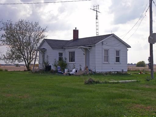 3263 East 8th Road Utica, IL 61373 - Photo 9 of 9 a front view of a house with a garden