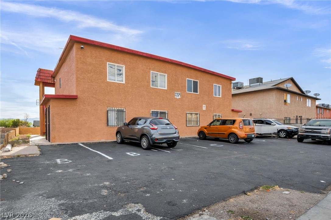 2269 Exeter Drive Las Vegas, NV 89156 - Photo 3 of 30 This two-story apartment building features multiple units with a spacious parking area for residents.