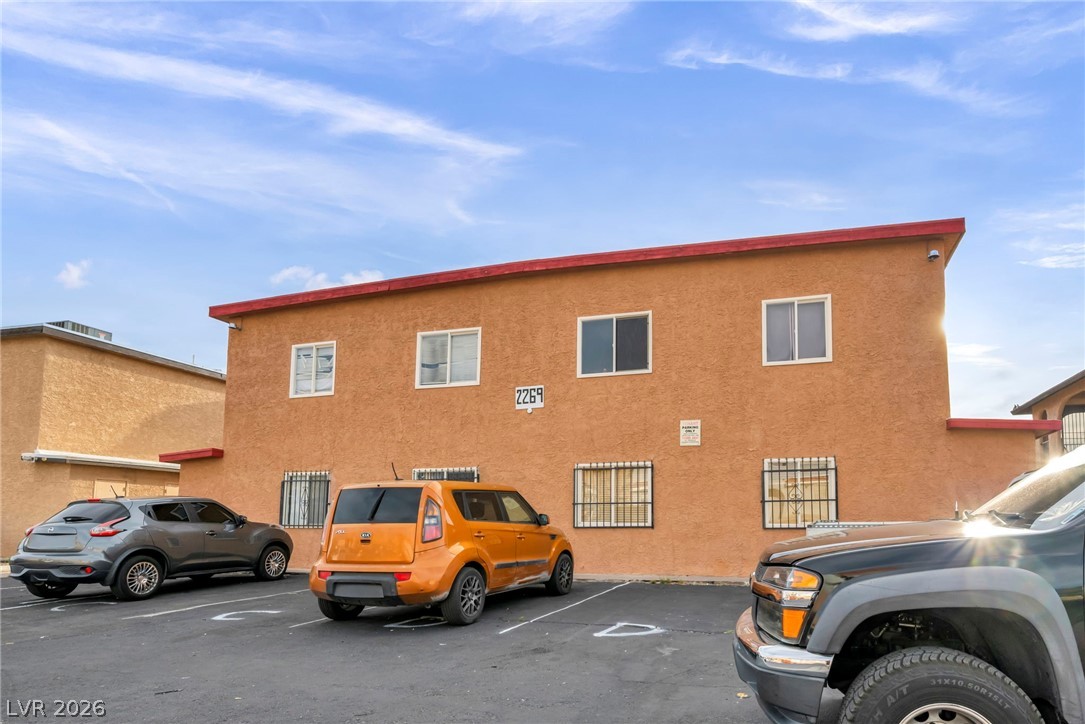 2269 Exeter Drive Las Vegas, NV 89156 - Photo 4 of 30 This residential building offers convenient parking and a practical facade, ideal for urban living.