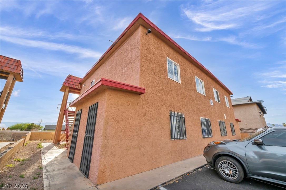 2269 Exeter Drive Las Vegas, NV 89156 - Photo 5 of 30 This multi-story dwelling features stucco construction and visible security cameras for peace of mind.