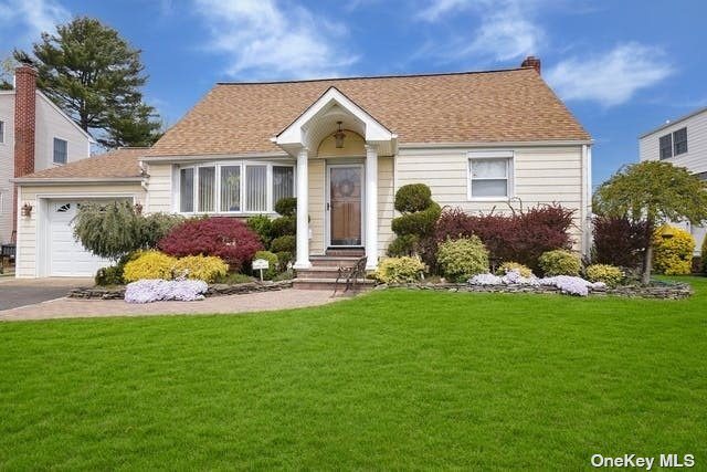36 Lewis Lane Syosset, NY 11791 - Photo 1 of 1 a front view of house with yard and green space