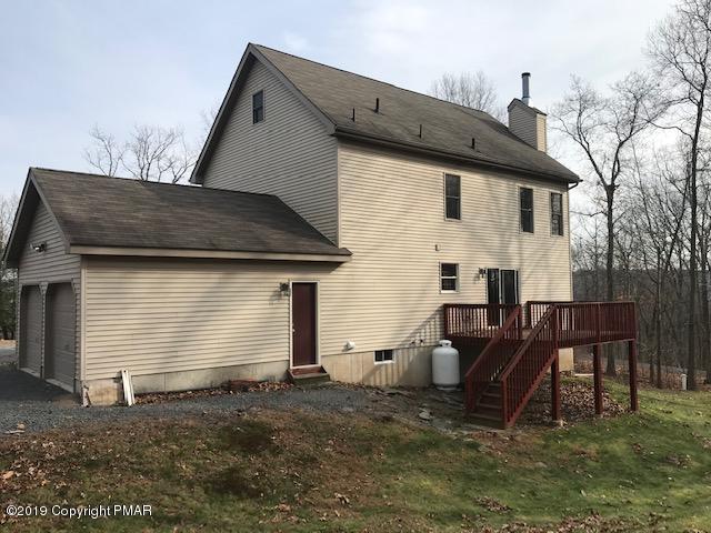 690 Buckle Boot Road Henryville, PA 18332 - Photo 5 of 24 a view of house with backyard and furniture
