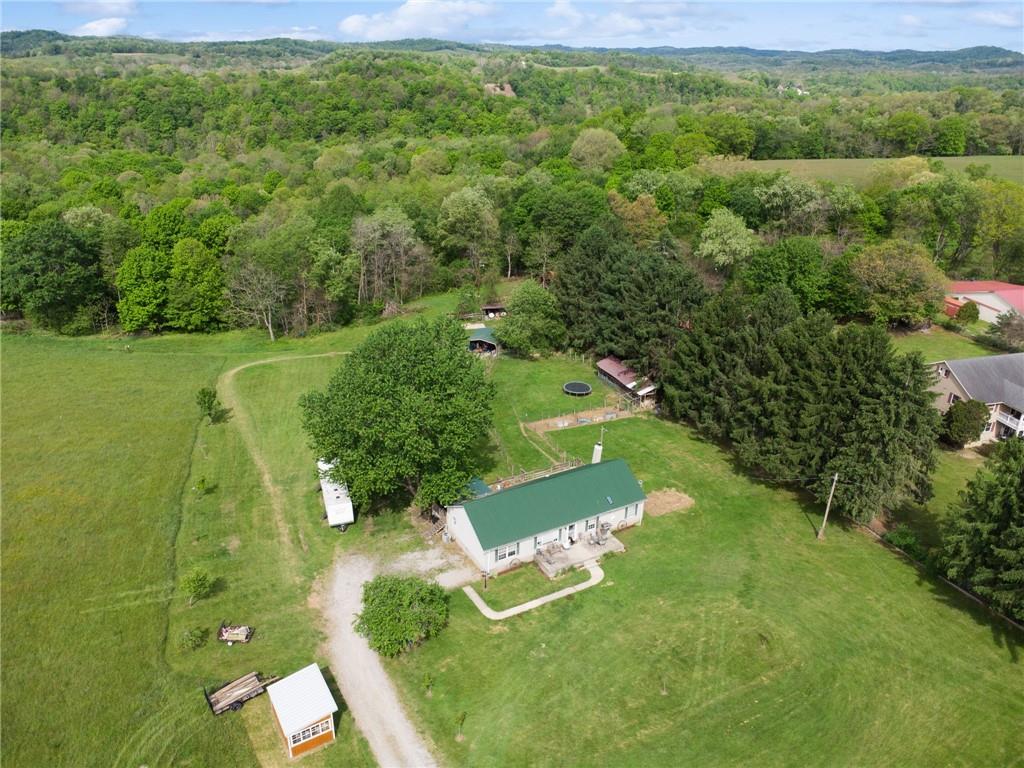 275 Adamik Road Clarksville, PA 15322 - Photo 1 of 39 an aerial view of a house with a yard