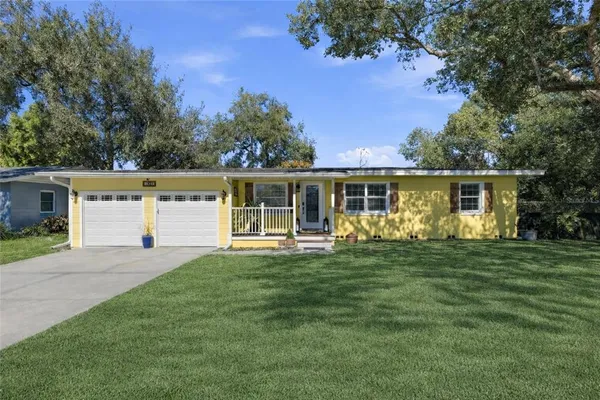 a front view of a house with a blue gate