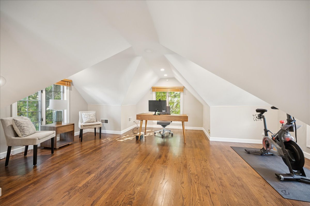 305 Poplar Street Winnetka, IL 60093 - Photo 23 of 26 a living room with furniture a wooden floor and a large window